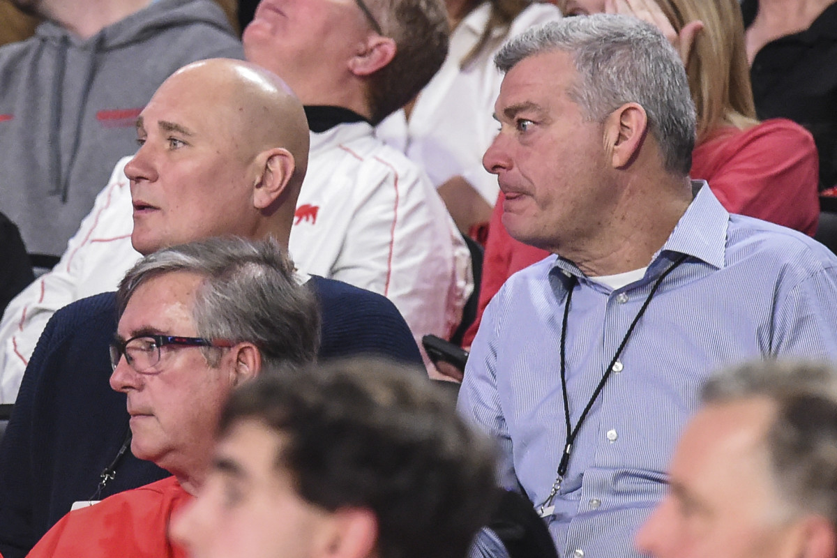 Jan 7, 2020; Athens, Georgia, USA; Atlanta Hawks general manger Travis Schlenk (dark blue shirt at left) and Hawks team owner Antony Ressler (right) watch a game between the Georgia Bulldogs and the Kentucky Wildcats during the second half at Stegeman Coliseum.