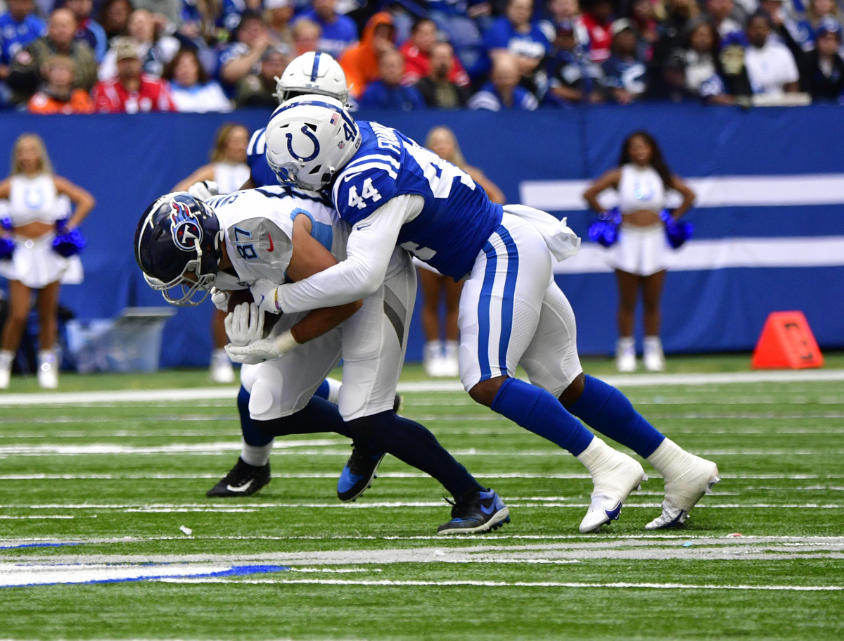 Oct 31, 2021; Indianapolis, Indiana, USA; Tennessee Titans tight end Geoff Swaim (87) is tackled by Indianapolis Colts outside linebacker Zaire Franklin (44) during the second quarter at Lucas Oil Stadium.