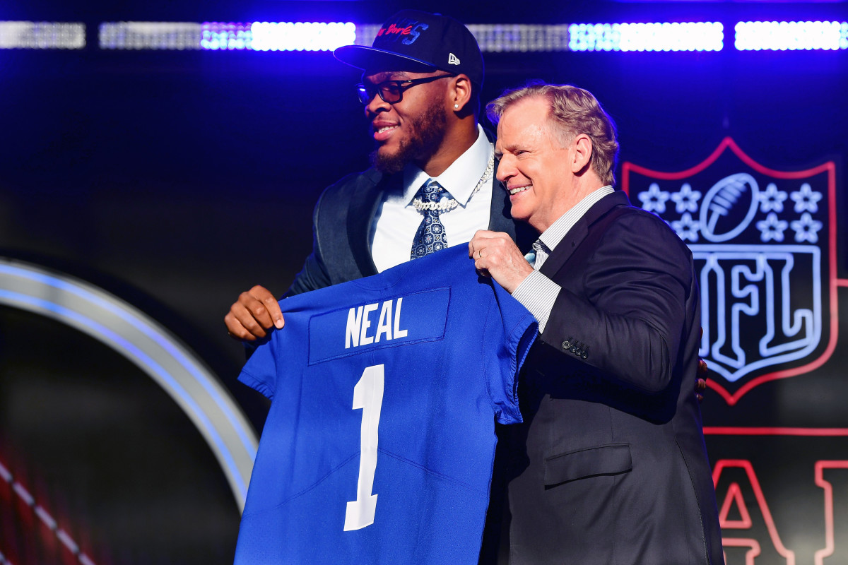 Alabama offensive tackle Evan Neal with NFL commissioner Roger Goodell after being selected as the seventh overall pick to the New York Giants during the first round of the 2022 NFL Draft at the NFL Draft Theater.