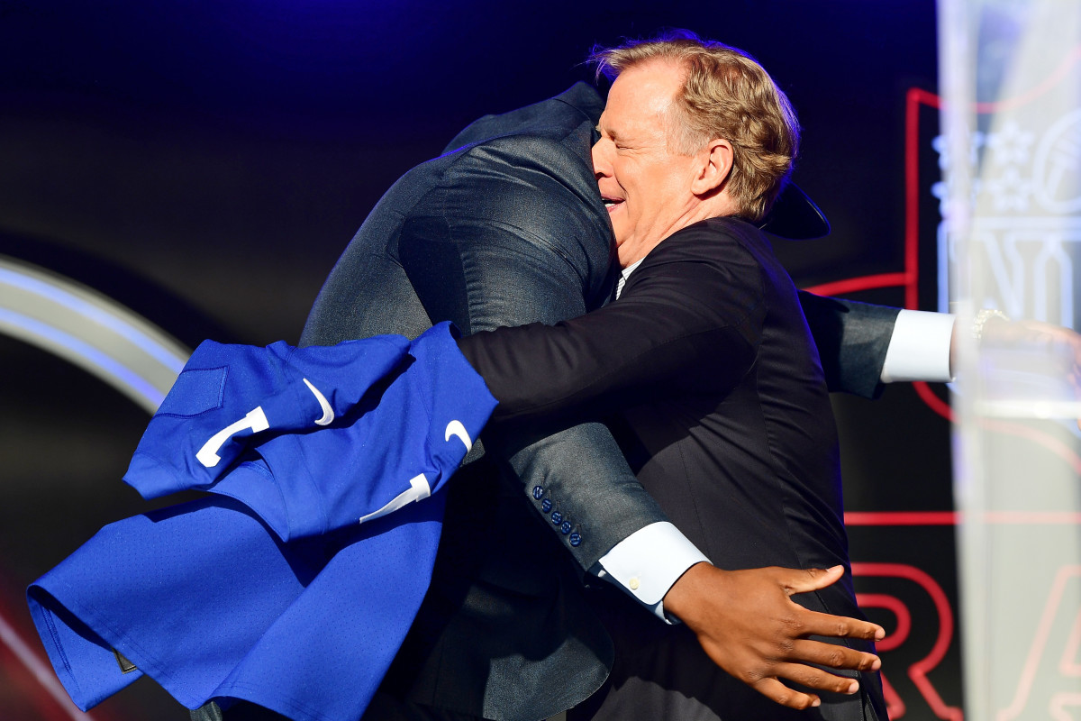 Alabama offensive tackle Evan Neal hugs NFL commissioner Roger Goodell after being selected as the seventh overall pick to the New York Giants during the first round of the 2022 NFL Draft at the NFL Draft Theater.