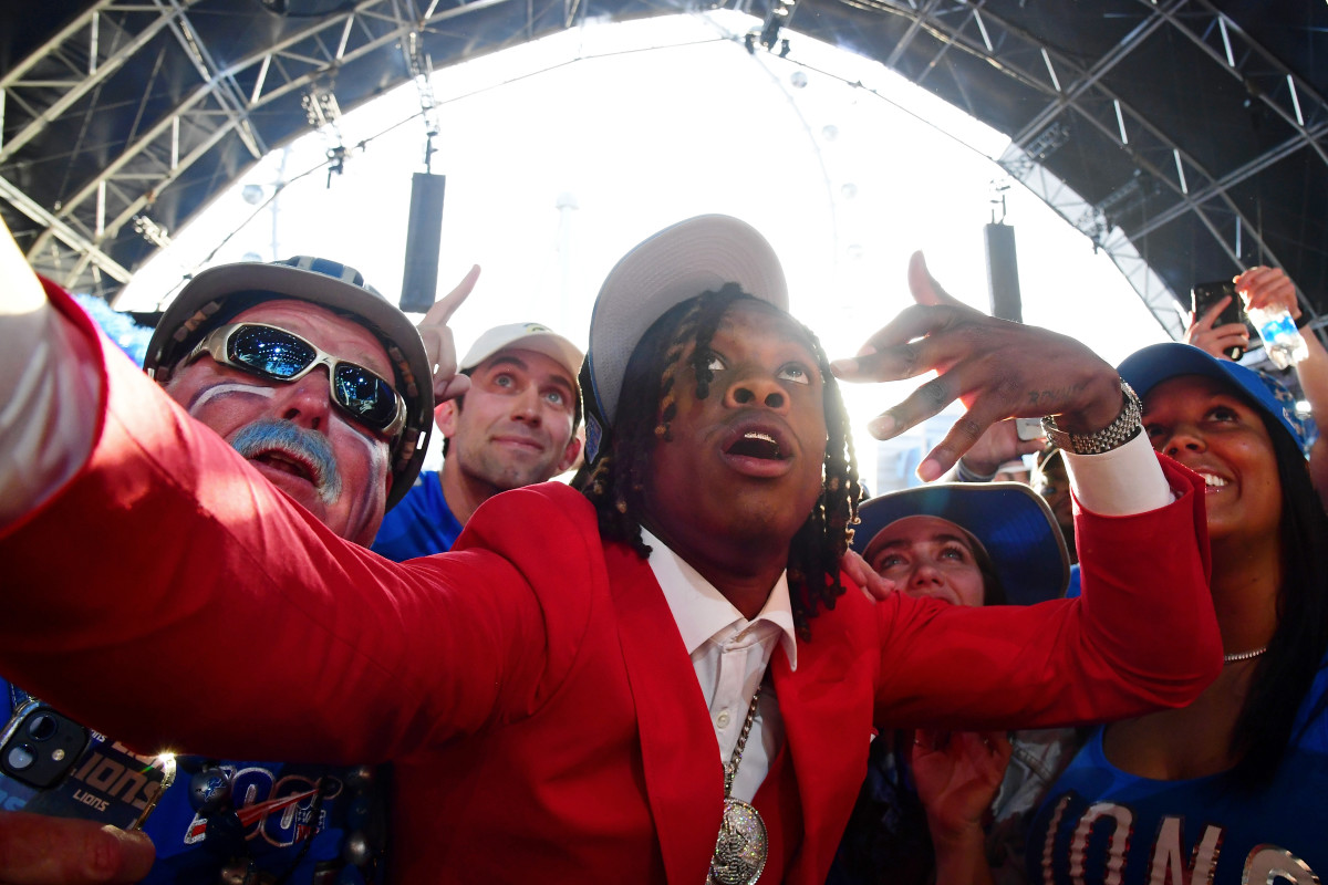 Alabama wide receiver Jameson Williams celebrates with fans after being selected as the twelfth overall pick to the Detroit Lions during the first round of the 2022 NFL Draft at the NFL Draft Theater.