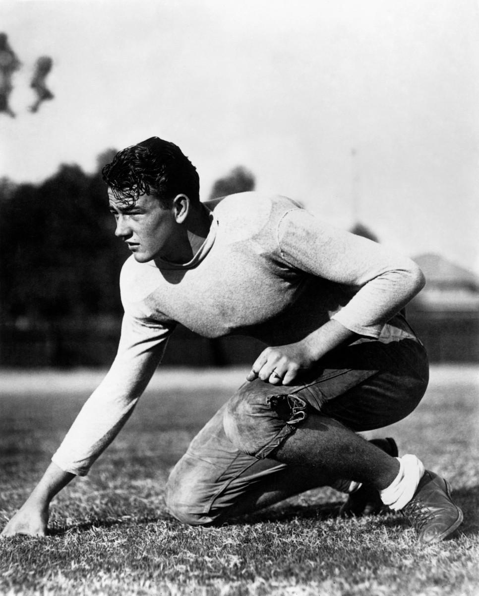Wayne played football for USC in the 1920s before injuries pushed him to pursue acting.