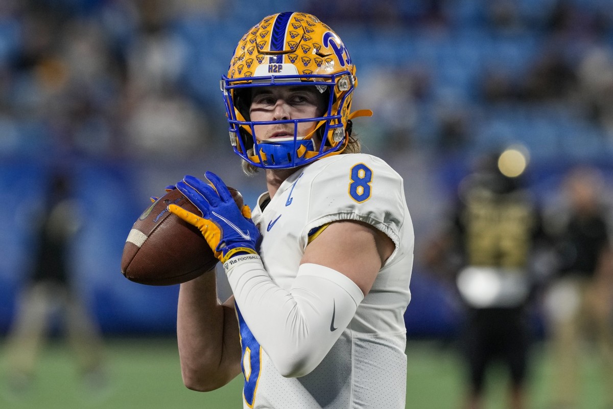 Dec 4, 2021; Charlotte, NC, USA; Pittsburgh Panthers quarterback Kenny Pickett (8) warms up before the ACC championship game against the Wake Forest Demon Deacons at Bank of America Stadium. Mandatory Credit: Jim Dedmon-USA TODAY Sports