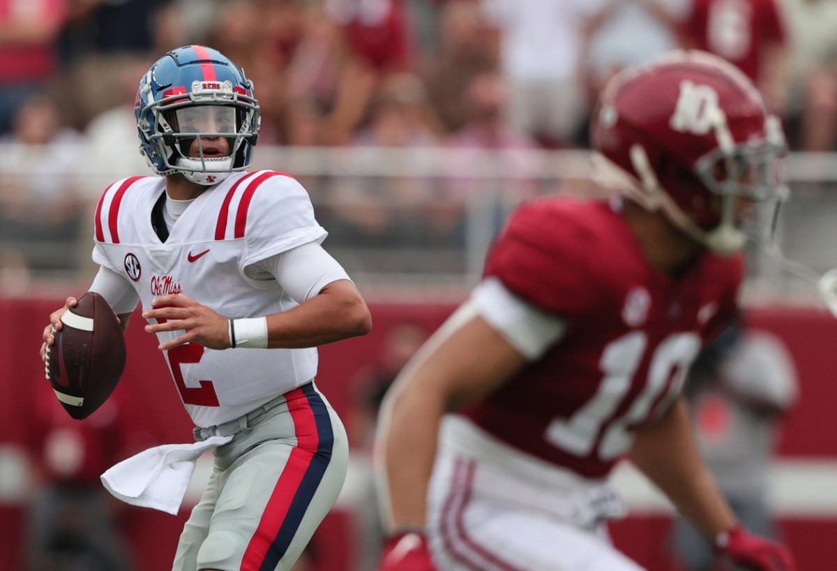 Mississippi Rebels quarterback Matt Corral (2) rolls out to pass against Alabama. Mandatory Credit: Butch Dill-USA TODAY Sports