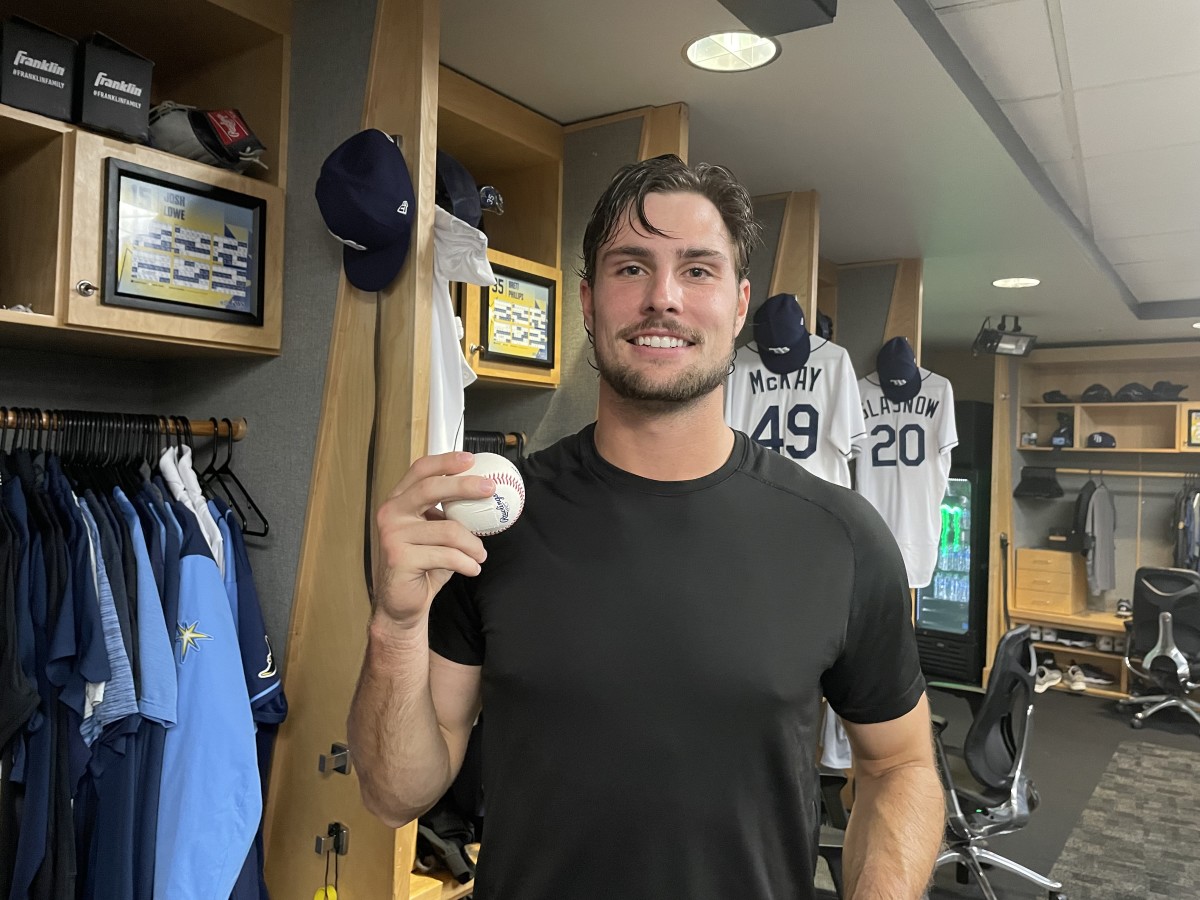 Tampa Bay Rays rookie Josh Lowe shows off the ball he hit for his first major-league home run on Friday night against the Minnesota Twins. (Photo by Tom Brew/InsideTheRays.com)