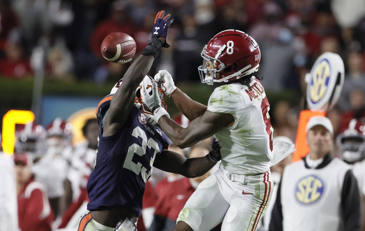 Auburn Tigers cornerback Roger McCreary (23) breaks up a pass intended for Alabama Crimson Tide wide receiver John Metchie III (8) in the fourth quarter at Jordan-Hare Stadium.