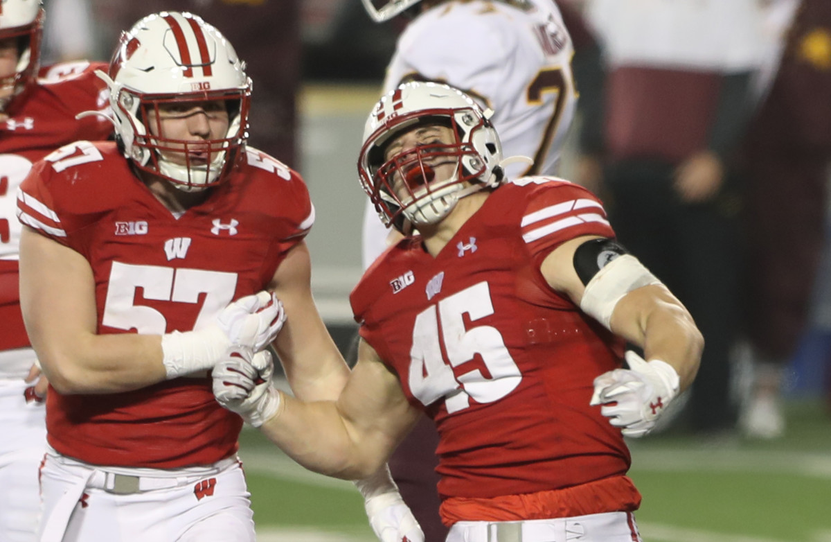 Dec 19, 2020; Madison, Wisconsin, USA; Wisconsin Badgers linebacker Leo Chenal (45) celebrates his third down tackle that stopped a Minnesota Golden Gophers advance during the second half at Camp Randall Stadium. Mandatory Credit: Mary Langenfeld-USA TODAY Sports