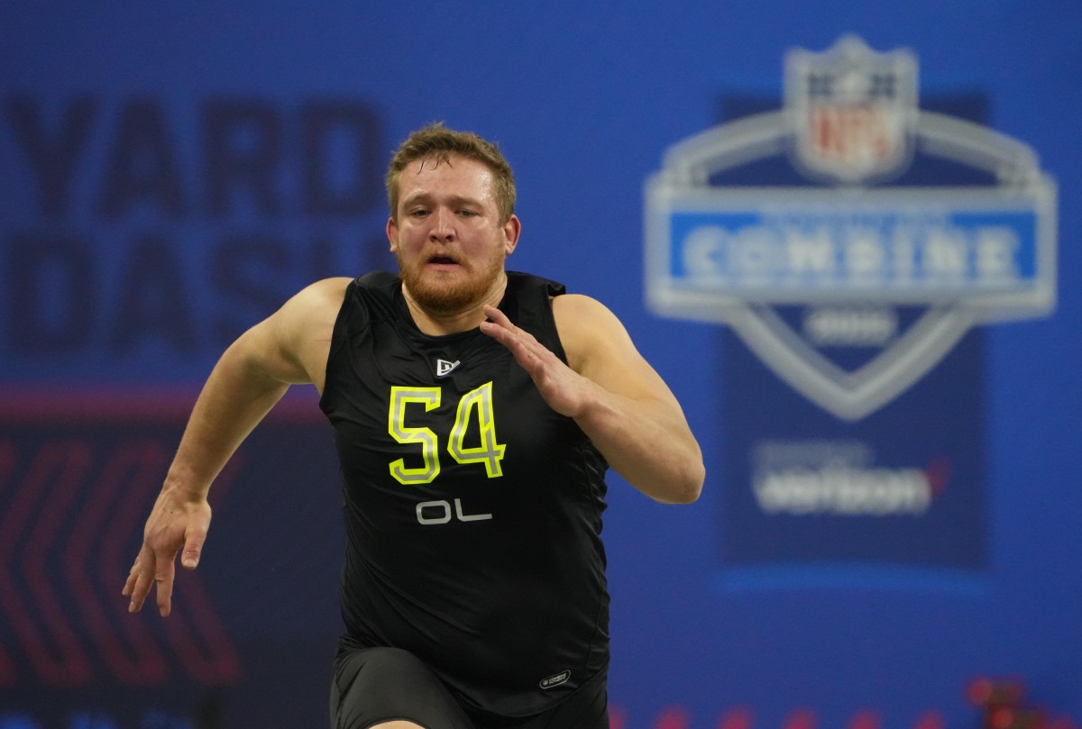 Mar 4, 2022; Indianapolis, IN, USA; North Dakota State offensive lineman Cordell Volson (OL54) runs the 40-yard dash during the 2022 NFL Scouting Combine at Lucas Oil Stadium. Mandatory Credit: Kirby Lee-USA TODAY Sports