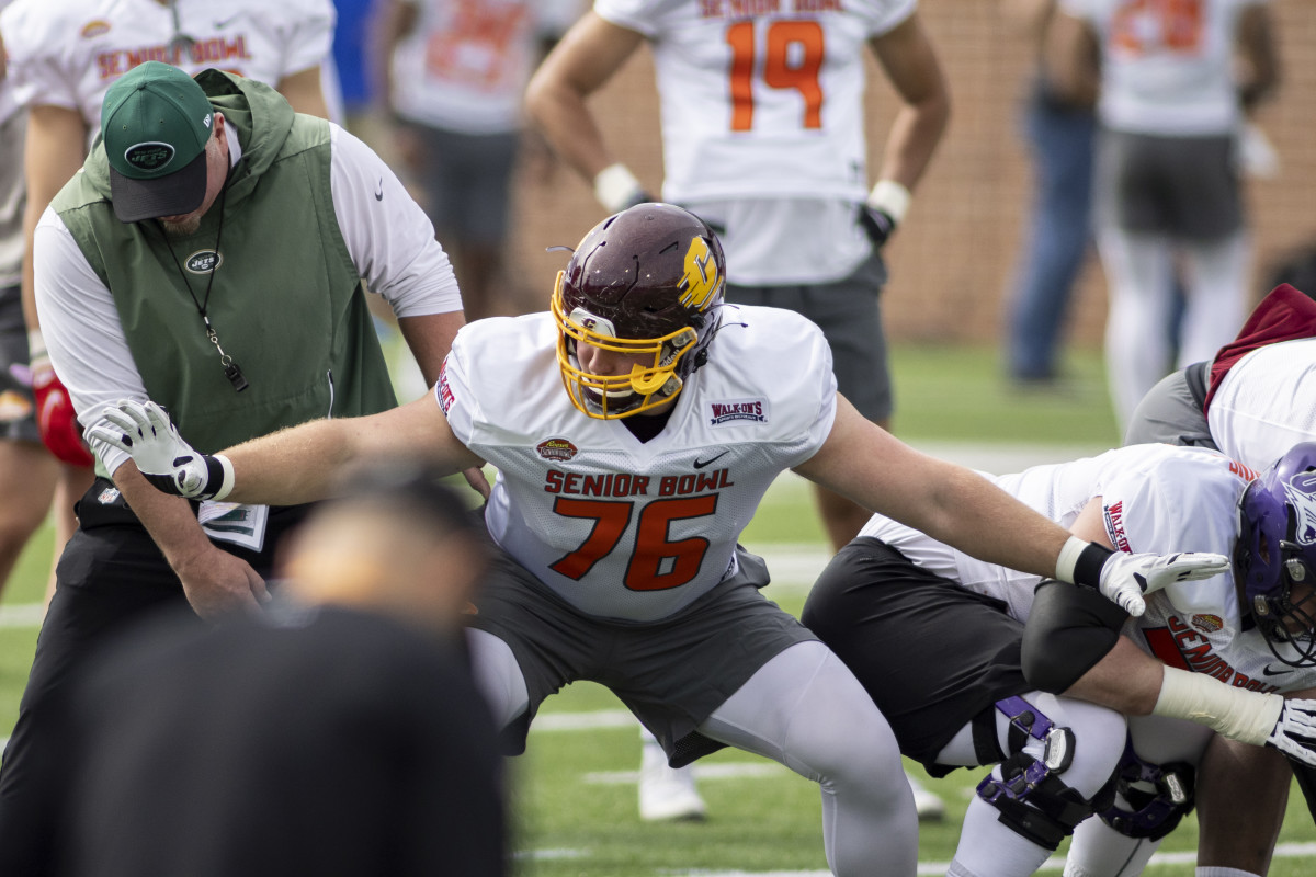 Feb 1, 2022; Mobile, AL, USA; National offensive lineman Bernhard Raimann of Central Michigan (76) works with a coach during National practice for the 2022 Senior Bowl at Hancock Whitney Stadium.
