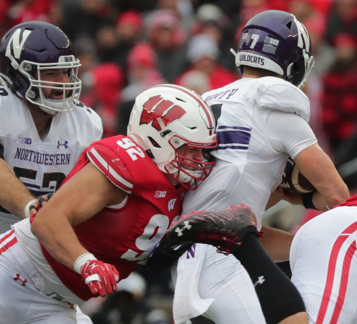 Wisconsin defensive end Matt Henningsen (92) sacks Northwestern quarterback Andrew Marty (7) during the second quarter of their game on Saturday, November 13, 2021 at Camp Randall Stadium in Madison, Wis. Wisconsin beat Northwestern 35-7.
