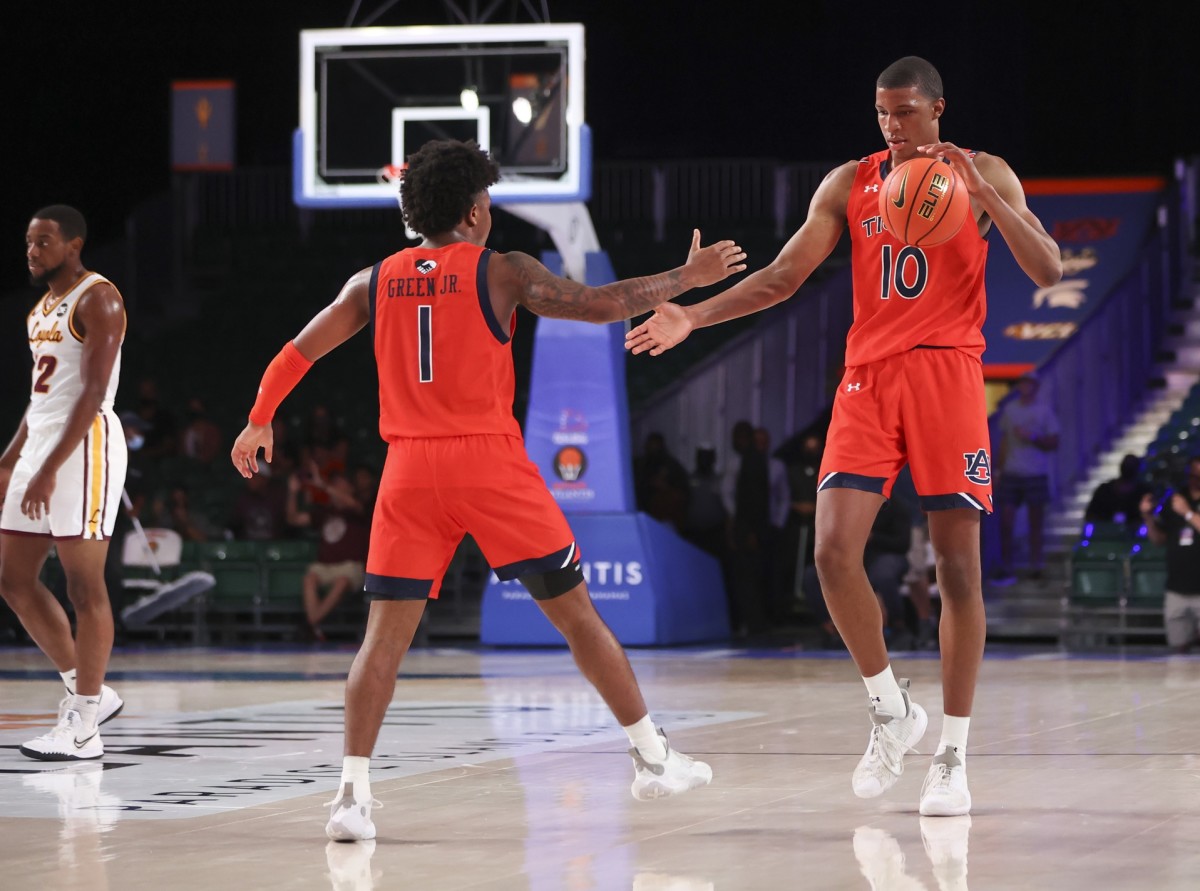Nov 25, 2021; Nassau, BHS; Auburn Tigers guard Wendell Green Jr. (1) and forward Jabari Smith (10) celebrate the win against the Loyola Ramblers in the 2021 Battle 4 Atlantis at Imperial Arena. Mandatory Credit: Kevin Jairaj-USA TODAY Sports