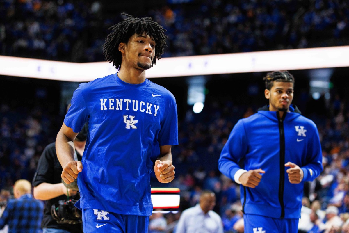 Jan 15, 2022; Lexington, Kentucky, USA; Kentucky Wildcats guard Shaedon Sharpe (left) runs on the court before the game against the Tennessee Volunteers at Rupp Arena at Central Bank Center. Credit: Jordan Prather-USA TODAY Sports