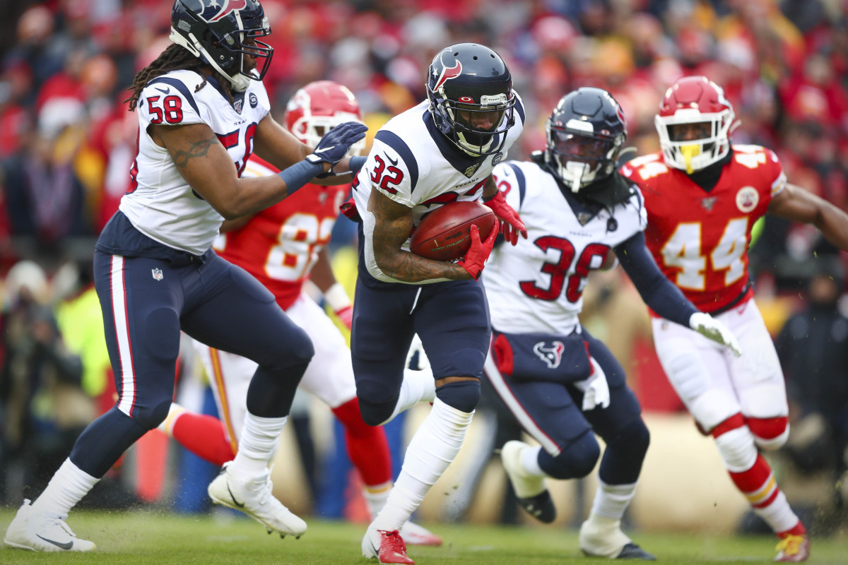 Jan 12, 2020; Kansas City, MO, USA; Houston Texans cornerback Lonnie Johnson Jr. (32) returns a blocked punt for a touchdown against the Kansas City Chiefs during the first quarter in a AFC Divisional Round playoff football game at Arrowhead Stadium. Mandatory Credit: Mark J. Rebilas-USA TODAY Sports