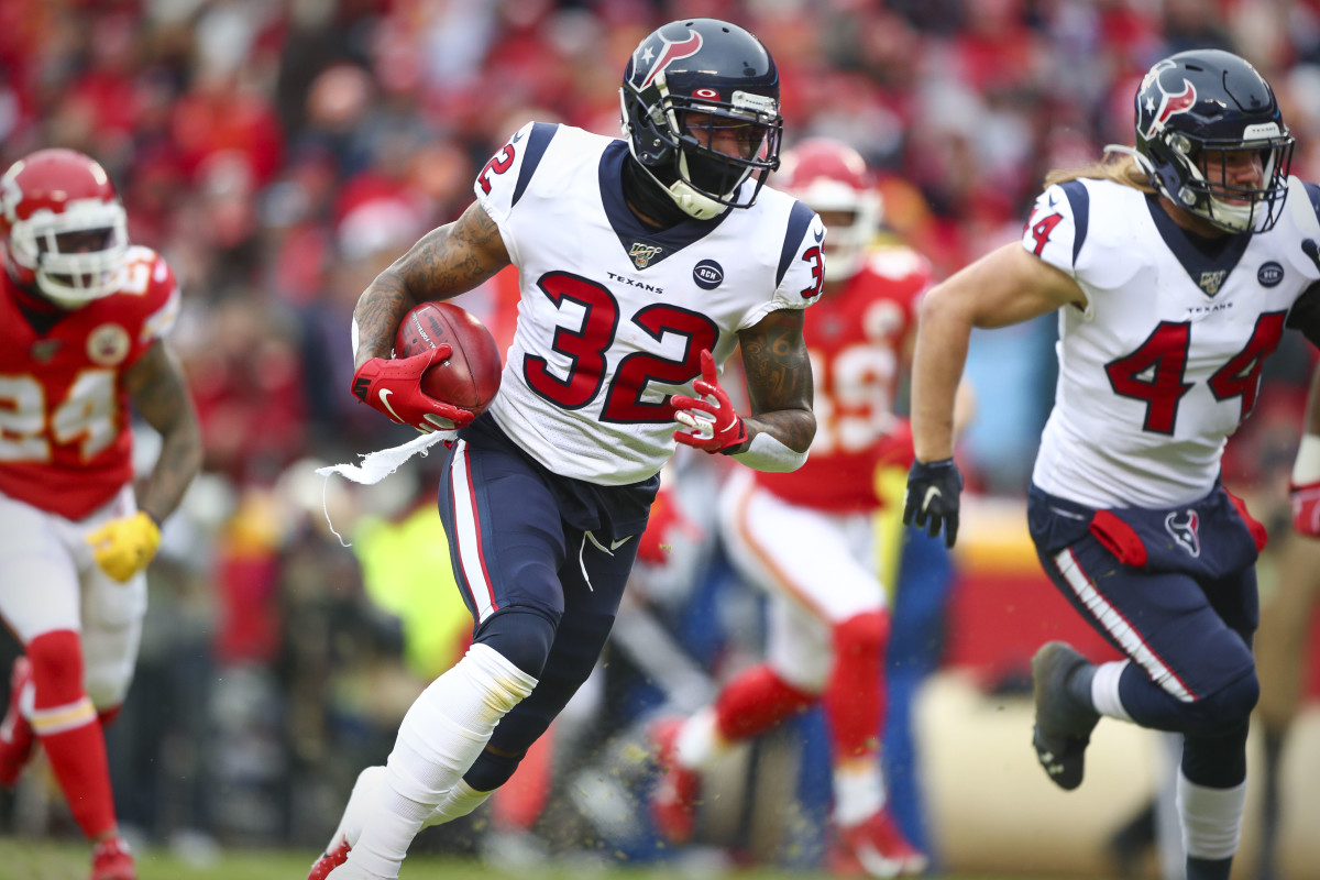 Jan 12, 2020; Kansas City, MO, USA; Houston Texans cornerback Lonnie Johnson Jr. (32) returns a blocked punt for a touchdown against the Kansas City Chiefs during the first quarter in a AFC Divisional Round playoff football game at Arrowhead Stadium. Mandatory Credit: Mark J. Rebilas-USA TODAY Sports