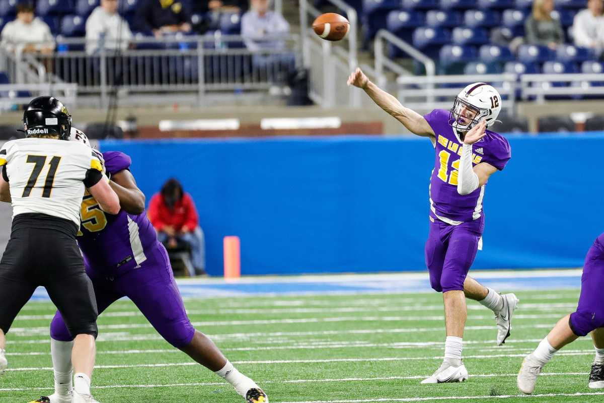 Warren De La Salle quarterback Brady Drogosh makes a pass against Traverse City Central during the first half of the Division 2 state final on Friday, Nov. 26, 2021, at Ford Field.