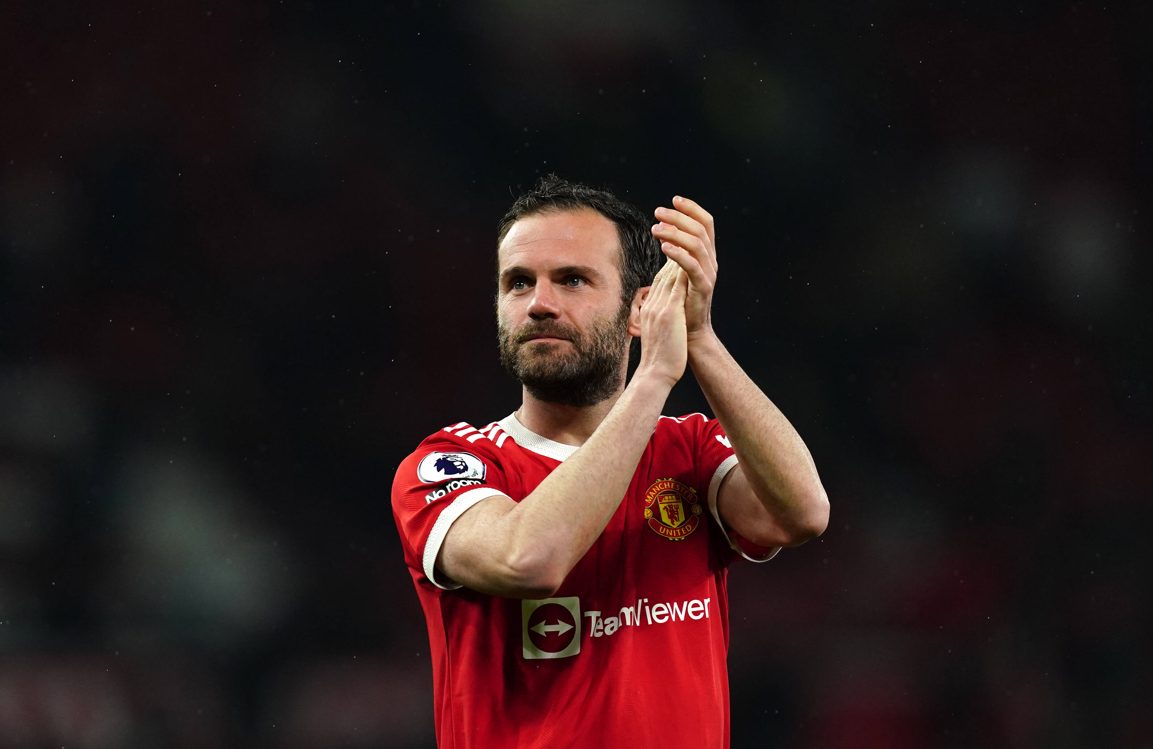 Juan Mata applauds Manchester United fans after his final Old Trafford appearance for the club in May 2022