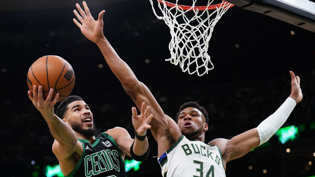Boston Celtics forward Jayson Tatum (0) shoots against Milwaukee Bucks forward Giannis Antetokounmpo (34) in the first quarter during game one of the second round for the 2022 NBA playoffs.