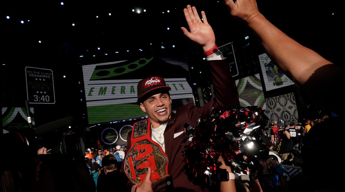 Southern California wide receiver Drake London celebrates with supporters after being chosen by the Atlanta Falcons with the eighth pick of the NFL football draft Thursday, April 28, 2022, in Las Vegas.