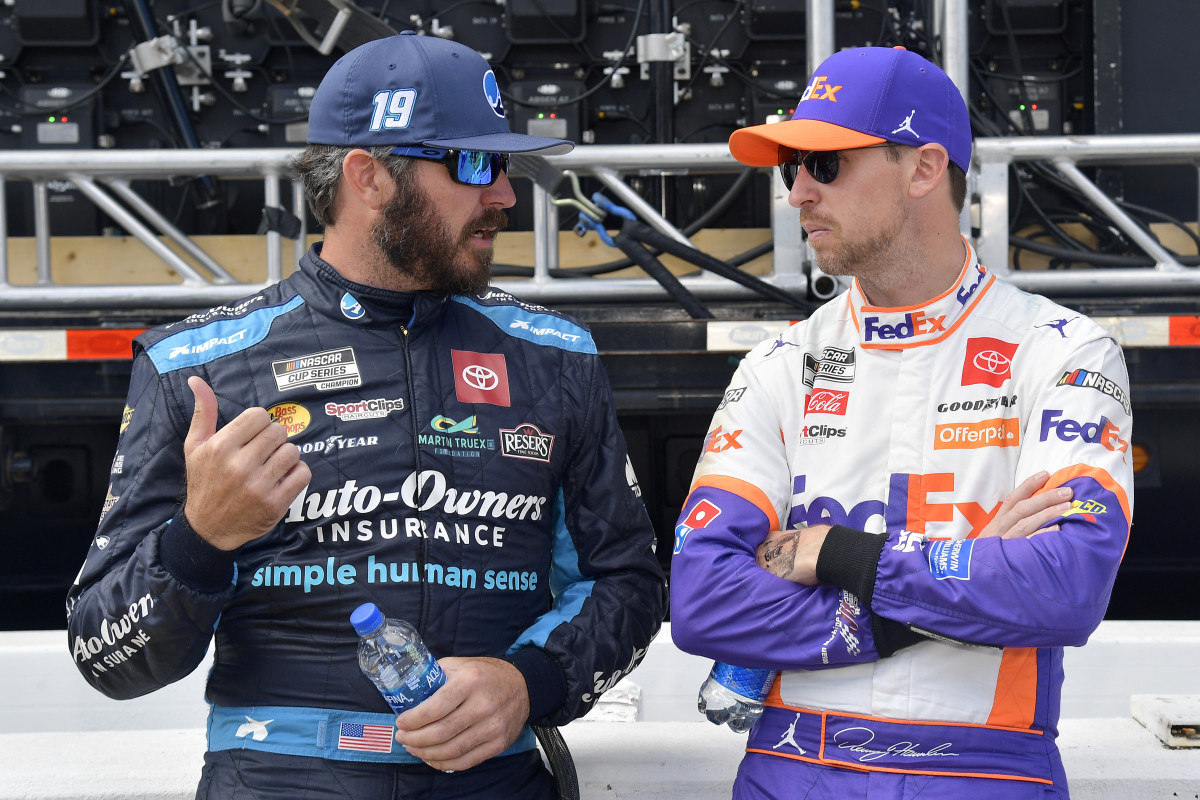 Denny Hamlin, right, shown with teammate Martin Truex Jr., may have the most options of any current JGR Cup driver. If things go south, he could potentially become an owner-driver for 23XI, the team he co-owns with NBA legend Michael Jordan. Photo: Logan Riely / Getty Images.