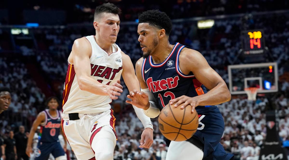 Philadelphia 76ers forward Tobias Harris (12) drives to the basket as Miami Heat guard Tyler Herro (14) defends, during the first half of Game 1 of an NBA basketball second-round playoff series, Monday, May 2, 2022, in Miami.