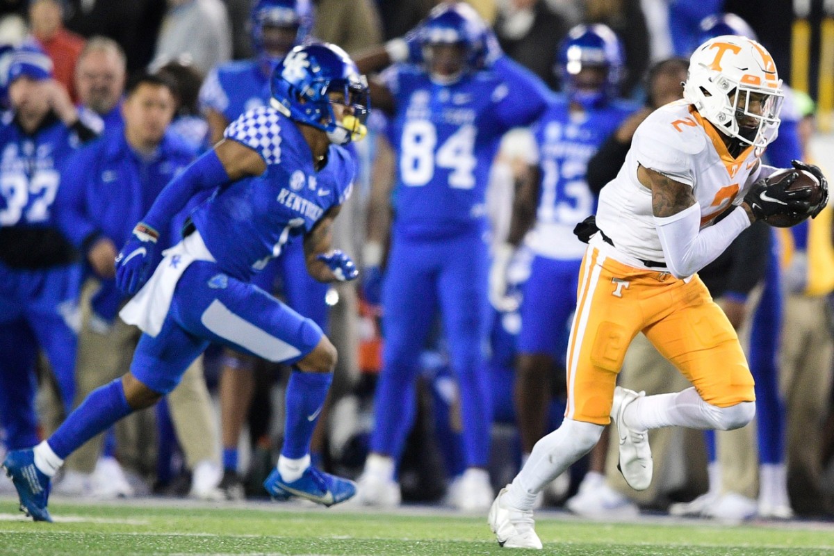 Tennessee defensive back Alontae Taylor (2) intercepts a pass intended for Kentucky receiver Wan'Dale Robinson (1) and returns it for a touchdown. Calvin Mattheis/News Sentinel / USA TODAY NETWORK