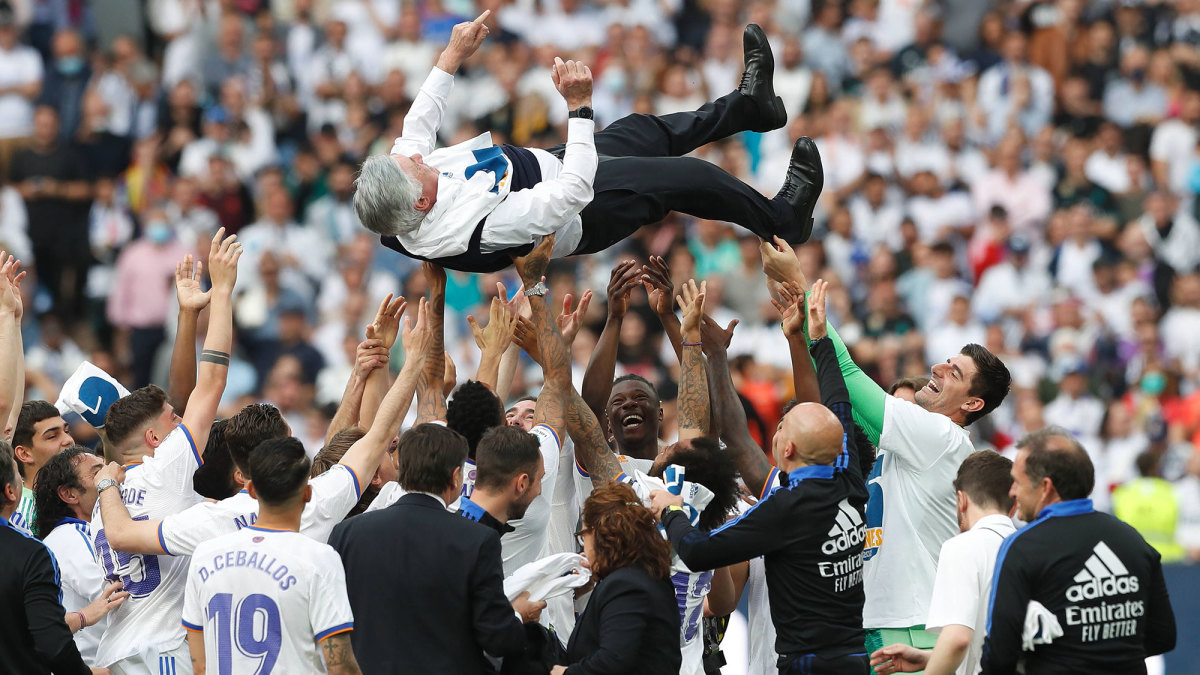 Real Madrid players hoist Carlo Ancelotti after winning La Liga