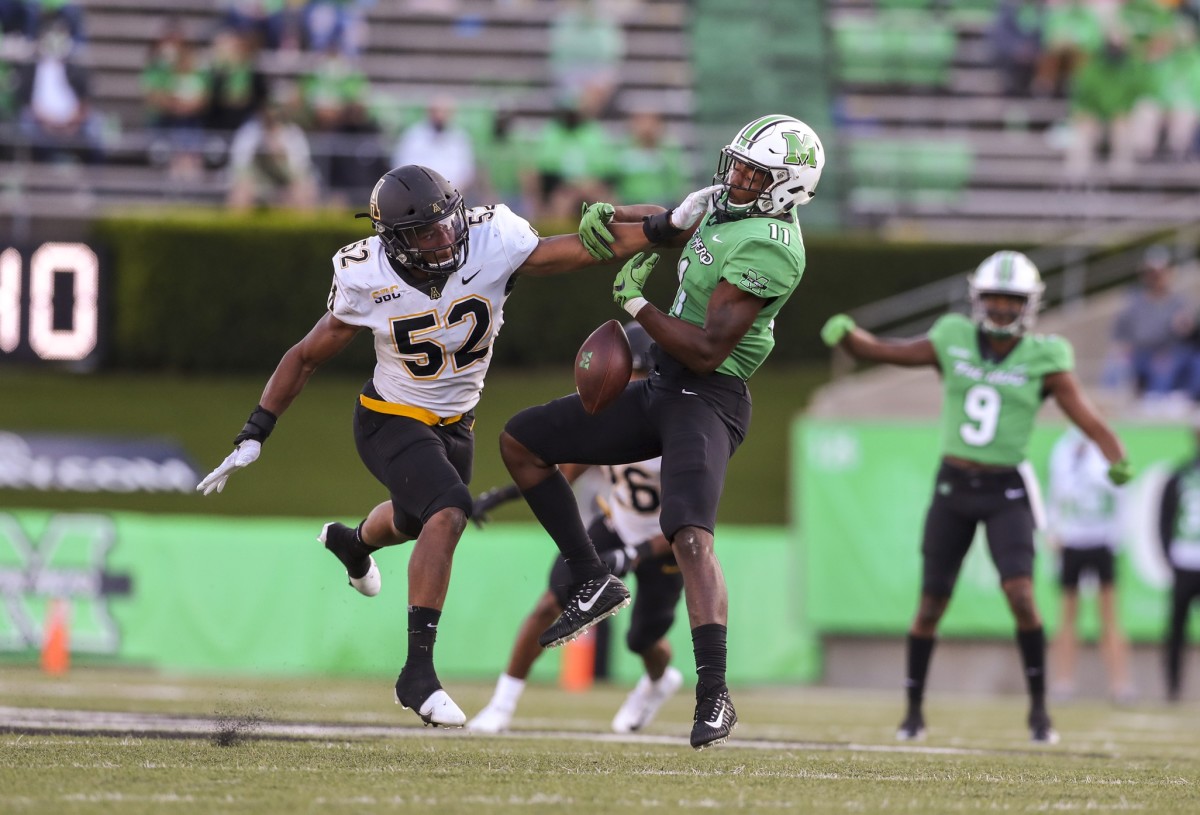 Appalachian State linebacker D'Marco Jackson (52) defends against Marshall tight end Xavier Gaines (11). Mandatory Credit: Ben Queen-USA TODAY 