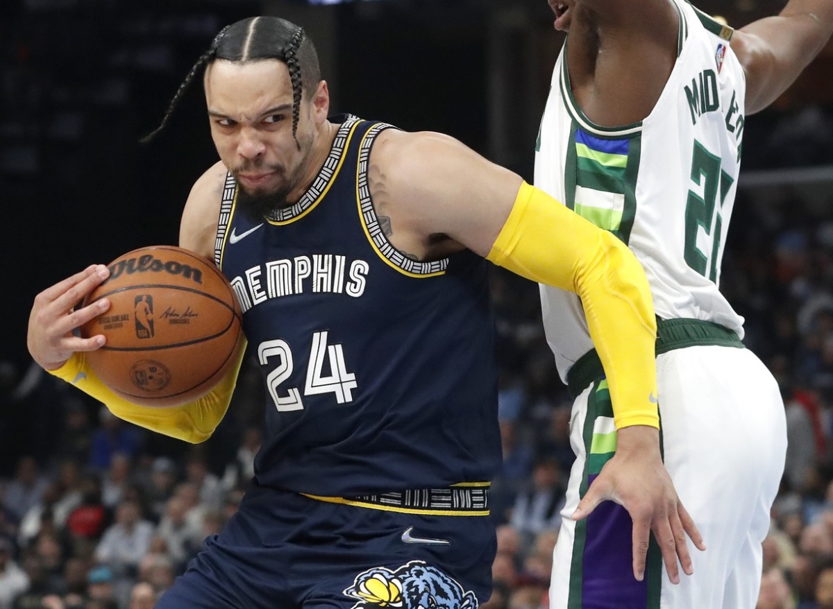 Mar 26, 2022; Memphis, Tennessee, USA; Memphis Grizzlies forward Dillon Brooks (24) controls the ball against Milwaukee Bucks forward Khris Middleton (22) during the first half at FedExForum. Mandatory Credit: Christine Tannous-USA TODAY Sports
