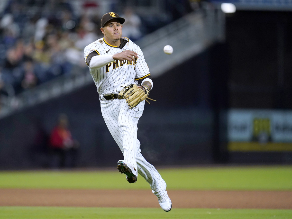 San Diego Padres third baseman Manny Machado throws to first for the out on Cincinnati Reds’ Joey Votto during the ninth inning of a baseball game Tuesday, April 19, 2022, in San Diego.