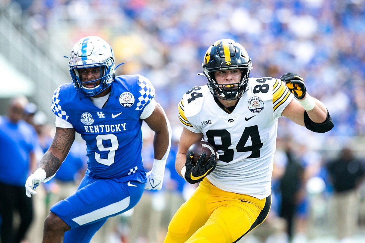 Iowa tight end Sam LaPorta (84) runs for extra yards after a catch as Kentucky defensive back Davonte Robinson (9) defends during a NCAA college football game in the Vrbo Citrus Bowl, Saturday, Jan. 1, 2022, at Camping World Stadium in Orlando, Fla. 211231 Iowa Kentucky Citrus Fb 010 Jpg Syndication Hawkcentral