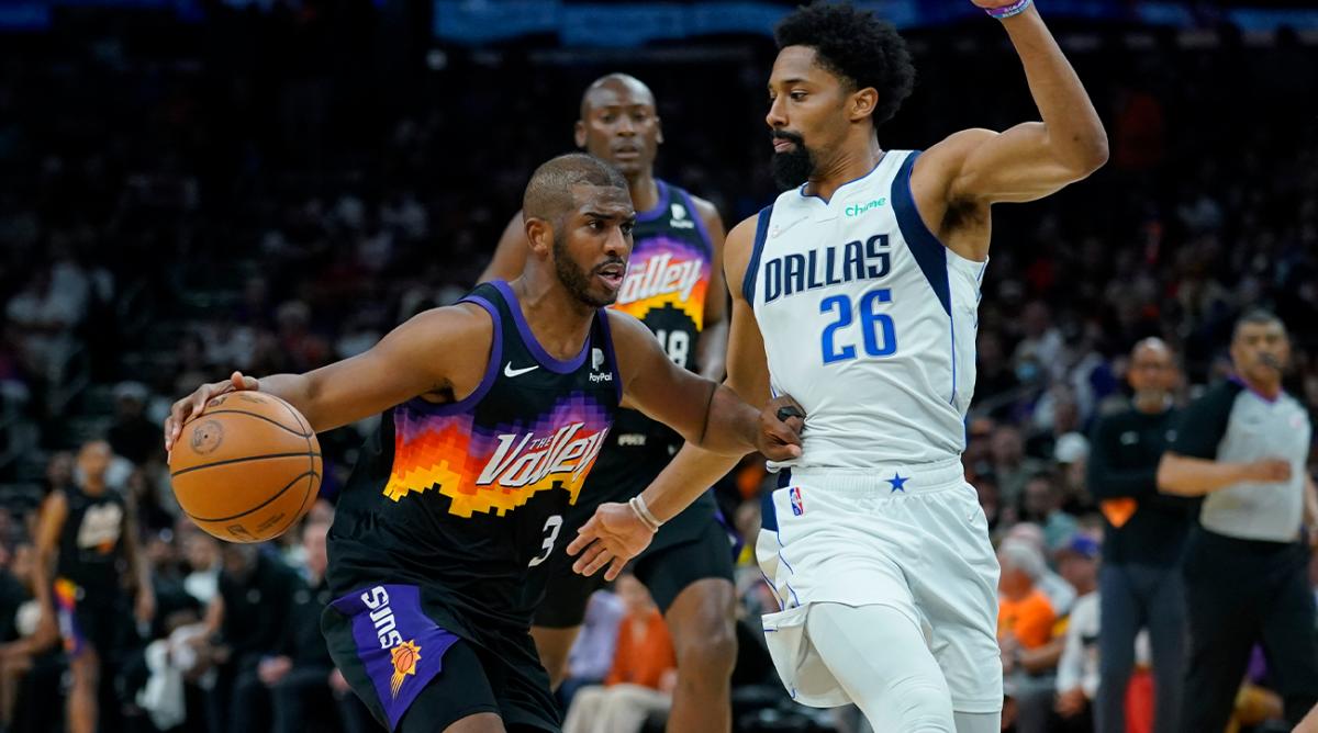 Phoenix Suns guard Chris Paul (3) drives to the basket against Dallas Mavericks guard Spencer Dinwiddie (26) during the second half of Game 2 of an NBA basketball second-round playoff series, Wednesday, May 4, 2022, in Phoenix.