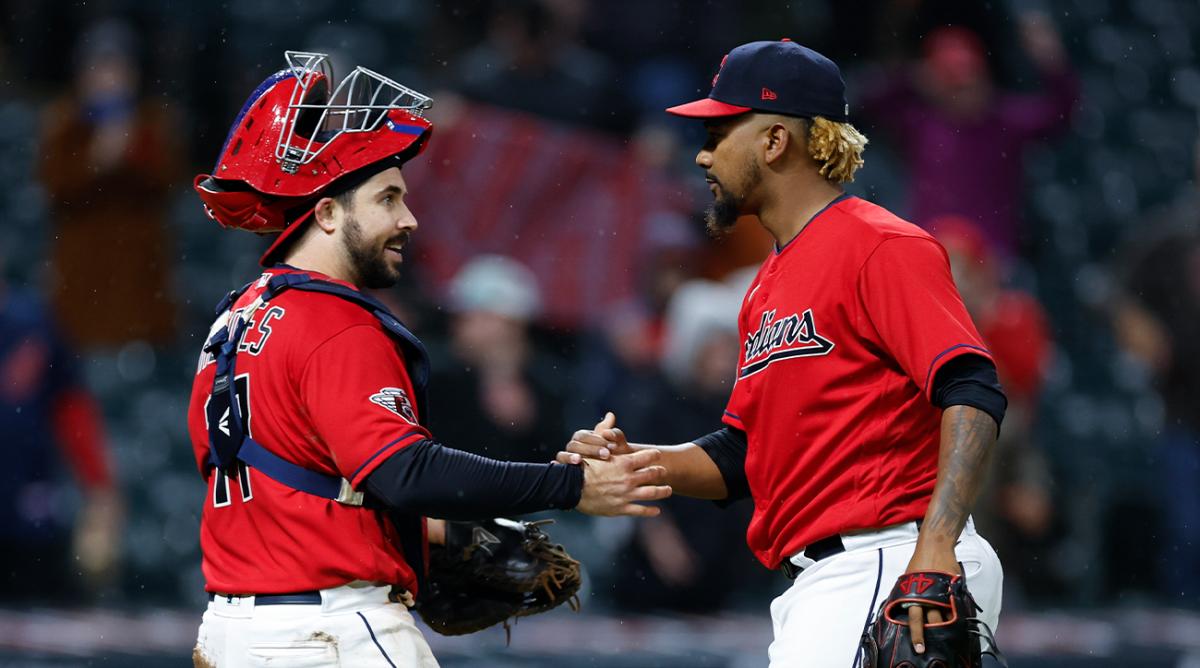 Cleveland Guardians’ Austin Hedges, left, and Emmanuel Clase celebrate the team’s win over the Toronto Blue Jays in a baseball game Thursday, May 5, 2022, in Cleveland.