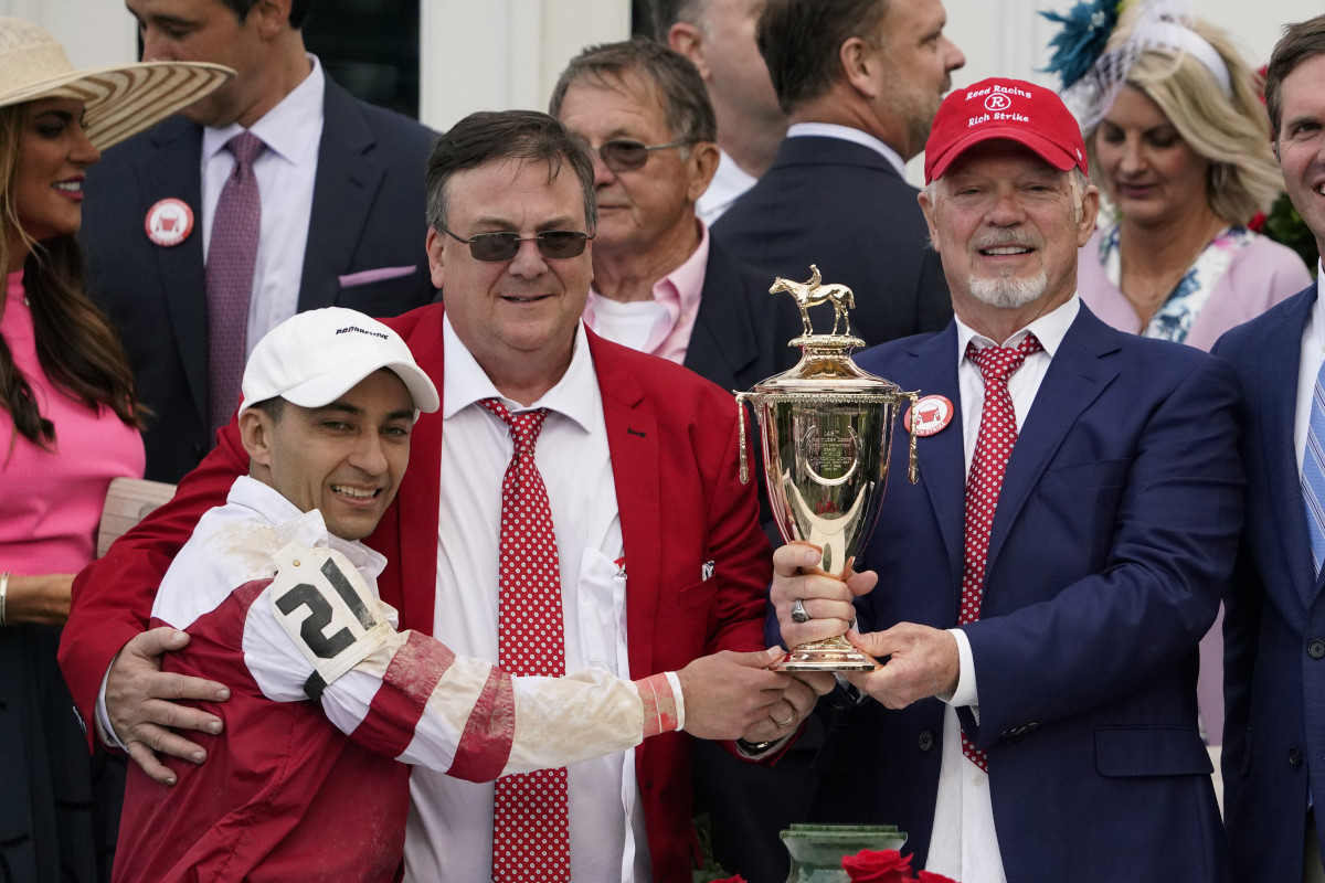Jockey Sonny Leon, trainer Eric Reed and owner Rick Dawson celebrate their first Derby win in their first Derby appearance with Rich Strike.
