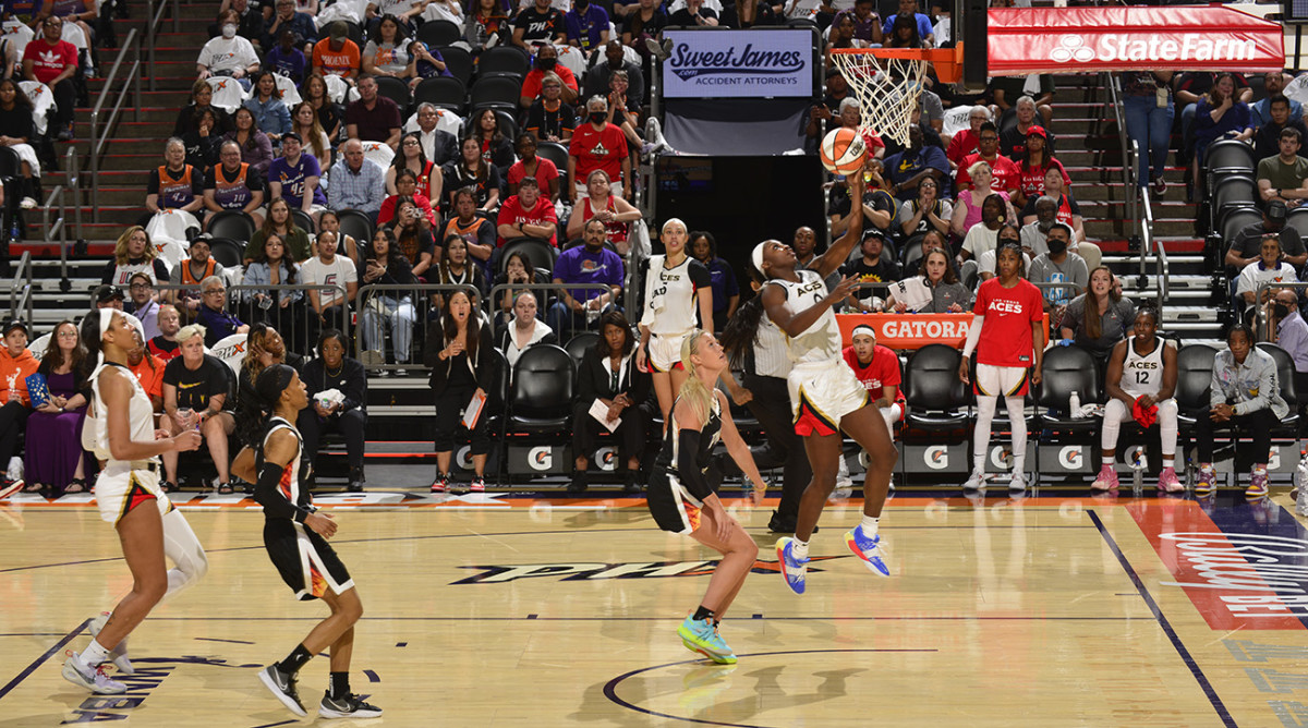 Aces guard Jackie Young hits a driving layup during a game against the Mercury.