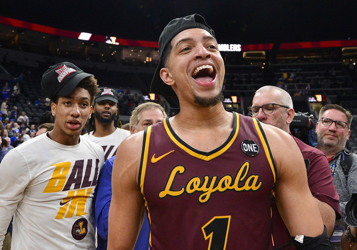 Loyola Ramblers guard Lucas Williamson (1) celebrates after the Ramblers defeated the Drake Bulldogs in the finals of the Missouri Valley Conference Tournament at Enterprise Center.
