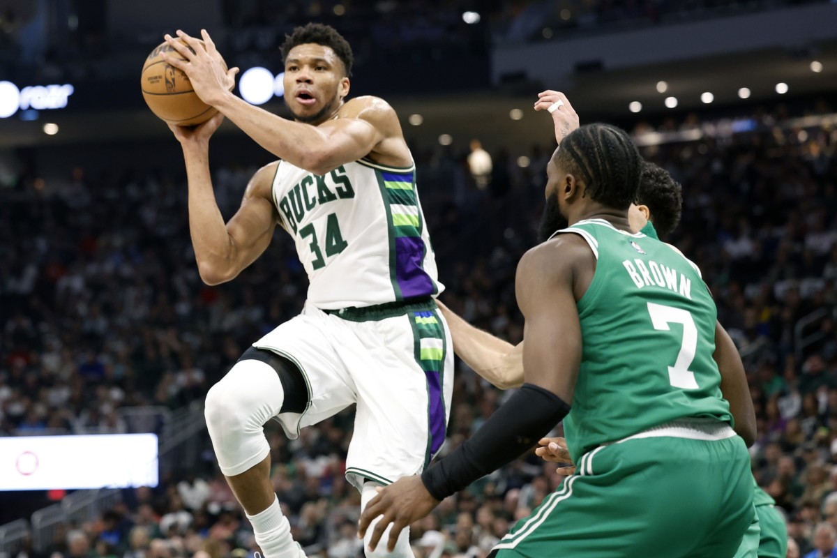 Milwaukee Bucks forward Giannis Antetokounmpo (34) passes the ball under pressure form Boston Celtics guard Jaylen Brown (7) during the second quarter during game three of the second round for the 2022 NBA playoffs at Fiserv Forum.