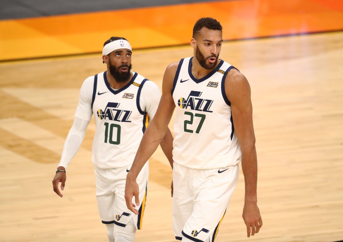 Utah Jazz center Rudy Gobert (27) and guard Mike Conley (10) against the Phoenix Suns at Phoenix Suns Arena.