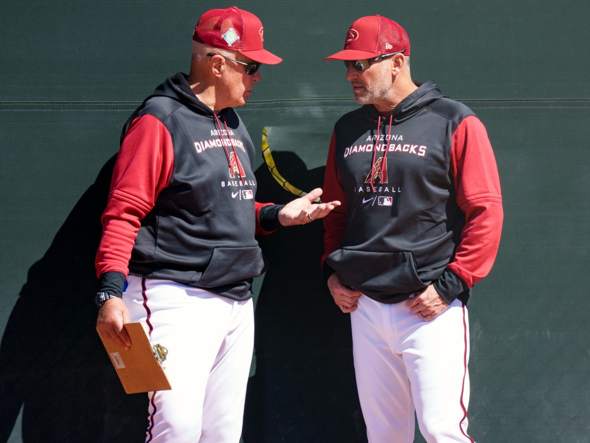 D-Backs manager, Torey Lovullo, right, talks with pitching coach, Brent Strom, left, at Salt River Fields at Talking Stick on March 11, 2022 in Scottsdale, Arizona.