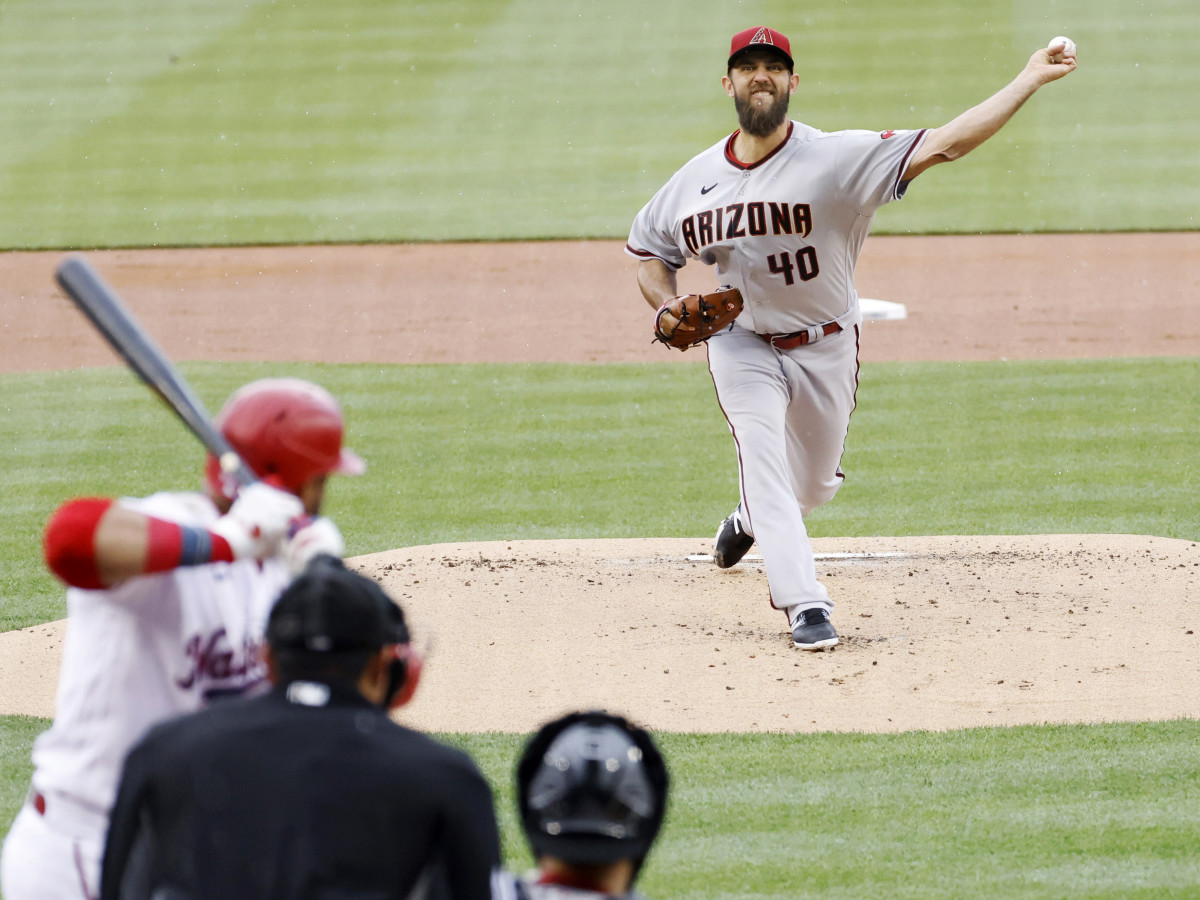 Apr 19, 2022; Washington, District of Columbia, USA; Arizona Diamondbacks starting pitcher Madison Bumgarner (40) pitches against Washington Nationals designated hitter Nelson Cruz (23) during the first inning at Nationals Park.