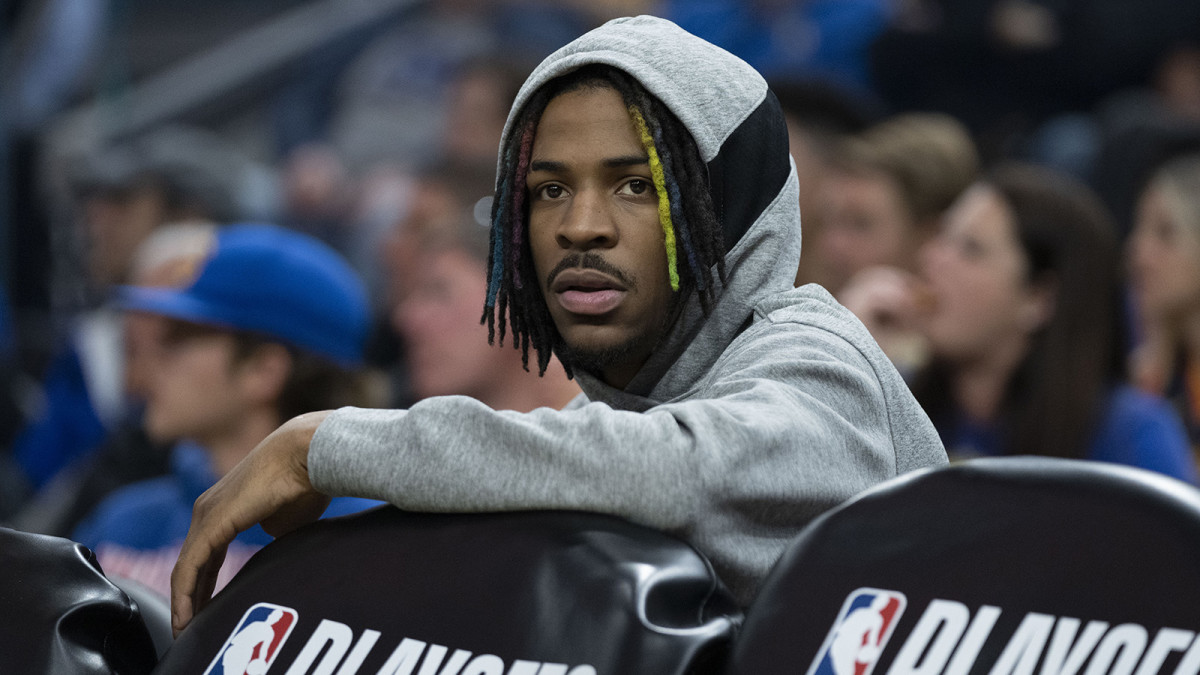 Memphis Grizzlies guard Ja Morant (12) sits on the bench against the Golden State Warriors.