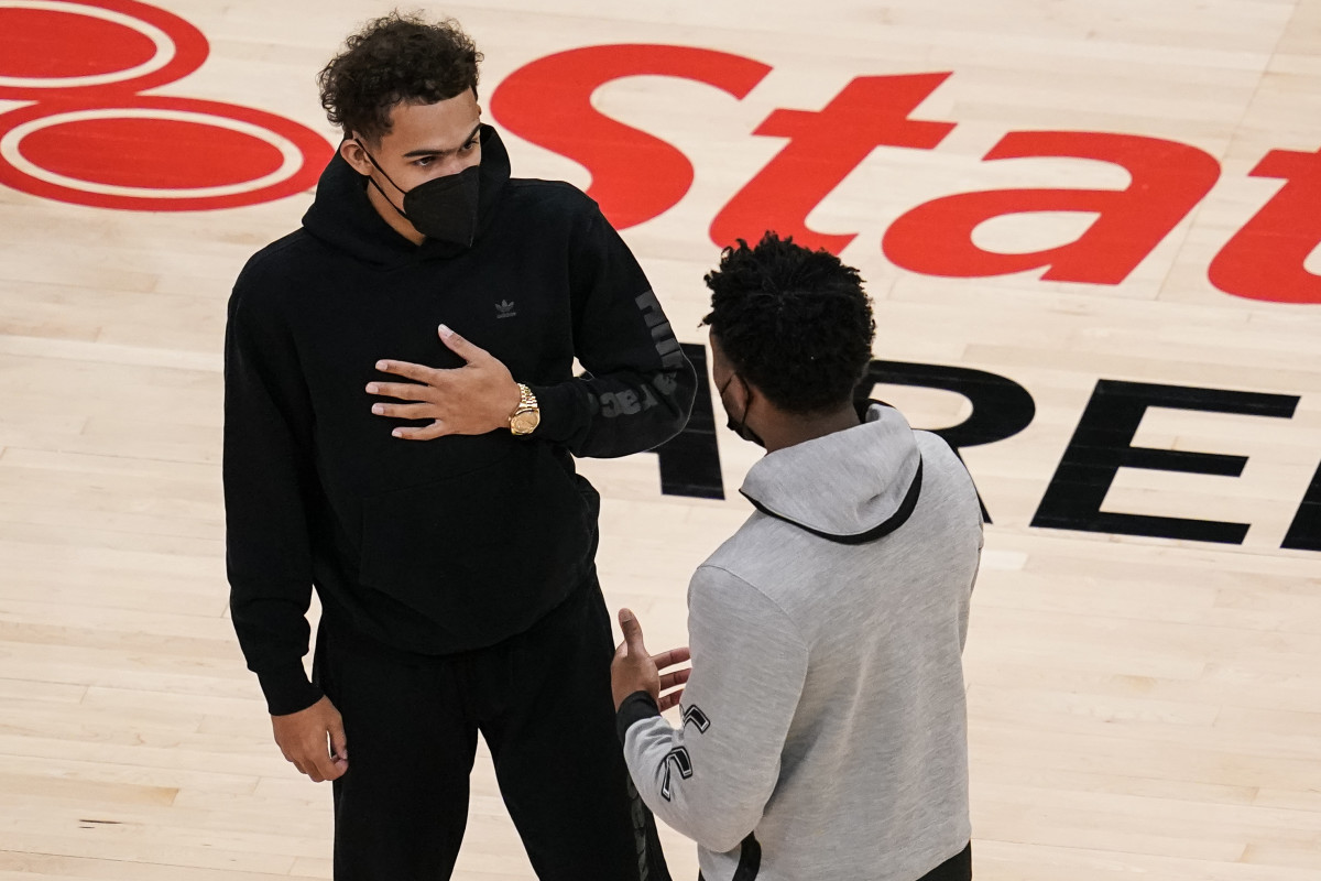 Atlanta Hawks guard Trae Young (left) talks with Utah Jazz guard Donovan Mitchell (right) after the Jazz defeated the Hawks at State Farm Arena.