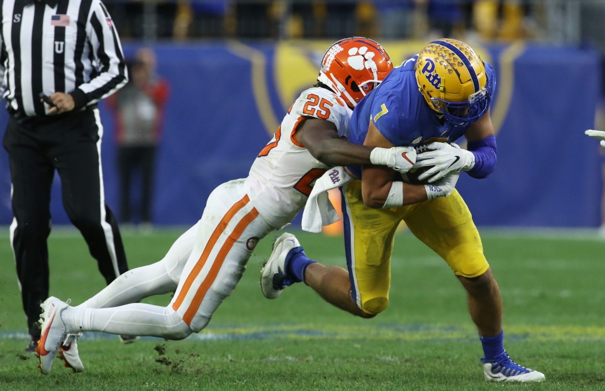 Pitt Panthers tight end Lucas Krull (7) runs after a catch as Clemson safety Jalyn Phillips (25) defends. Mandatory Credit: Charles LeClaire-USA TODAY Sports