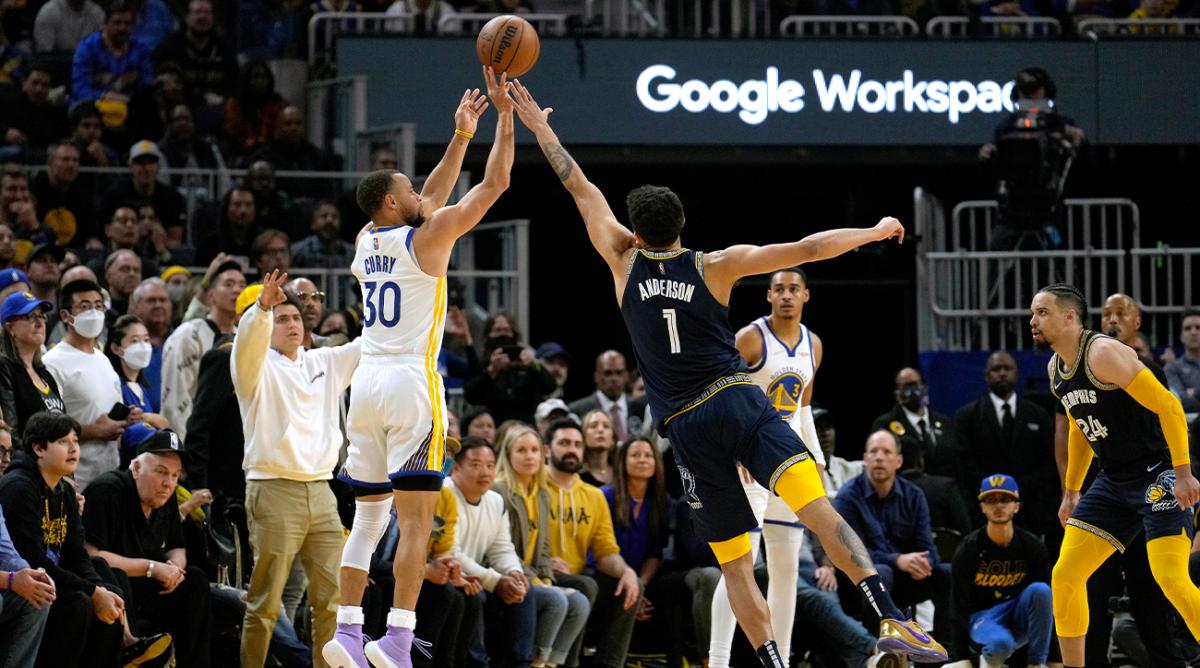 Golden State Warriors guard Stephen Curry (30) takes a 3-point shot over Memphis Grizzlies forward Kyle Anderson (1) during the second half of Game 4 of an NBA basketball Western Conference playoff semifinal in San Francisco, Monday, May 9, 2022. The Warriors won 101-98.