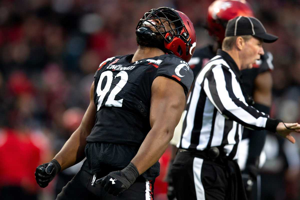 Cincinnati Bearcats defensive lineman Curtis Brooks (92) celebrates after sacking Southern Methodist Mustangs quarterback Tanner Mordecai (8) on 3rd down in the first half of the NCAA football game between the Cincinnati Bearcats and the Southern Methodist Mustangs on Saturday, Nov. 20, 2021, at Nippert Stadium in Cincinnati. Syndication The Enquirer
