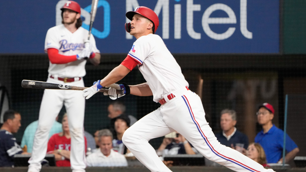 May 10, 2022; Arlington, Texas, USA; Texas Rangers shortstop Corey Seager (5) follows through on his home run against the Kansas City Royals during the first inning of a baseball game at Globe Life Field.
