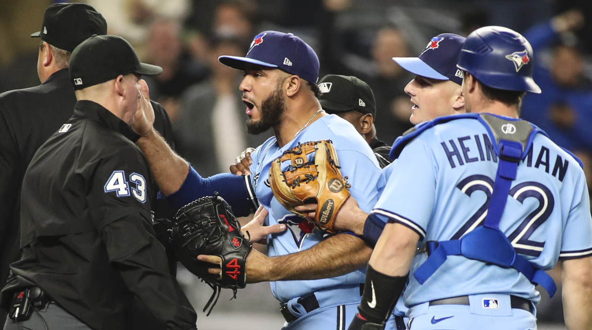Toronto Blue Jays relief pitcher Yimi Garcia (93) argues with umpire Shane Livensparger (43) after being ejected in the sixth inning against the New York Yankees at Yankee Stadium.