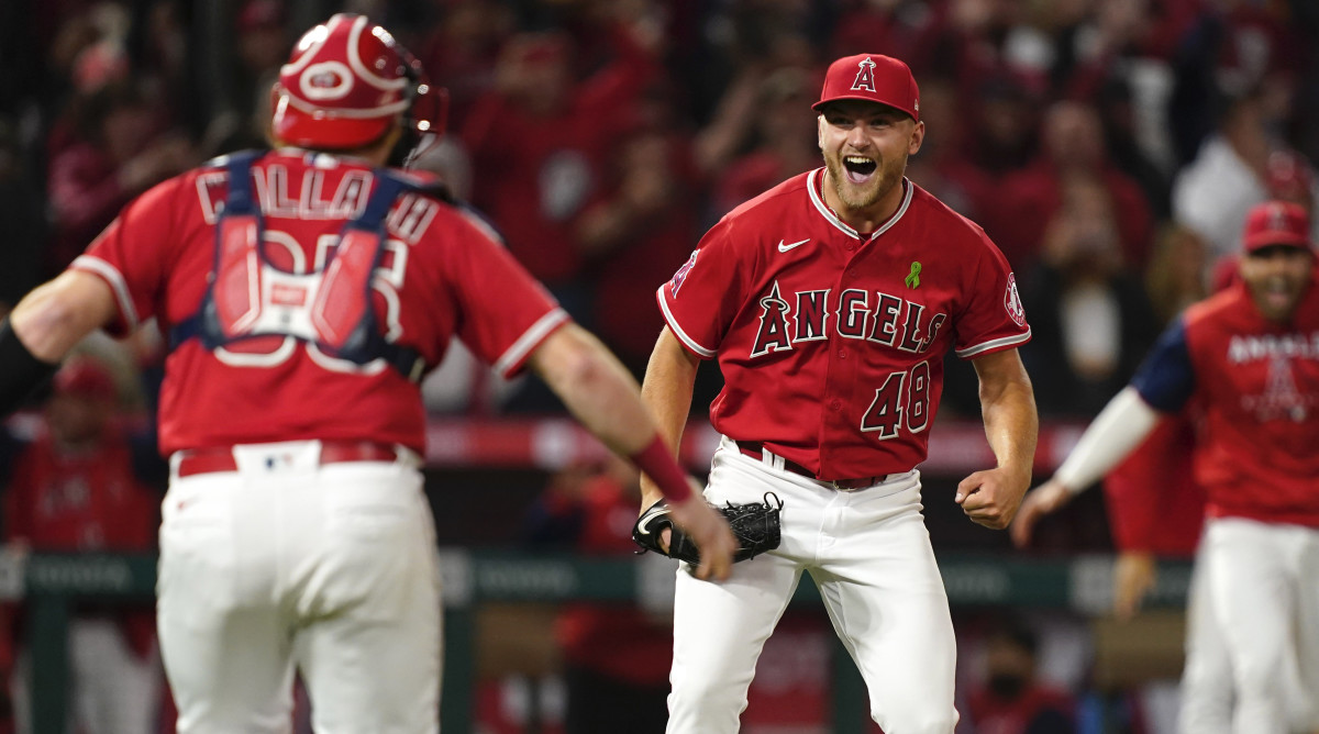 Los Angeles Angels starting pitcher Reid Detmers (48) celebrates with catcher Chad Wallach (35) after throwing a no hitter against the Tampa Bay Rays at Angel Stadium.