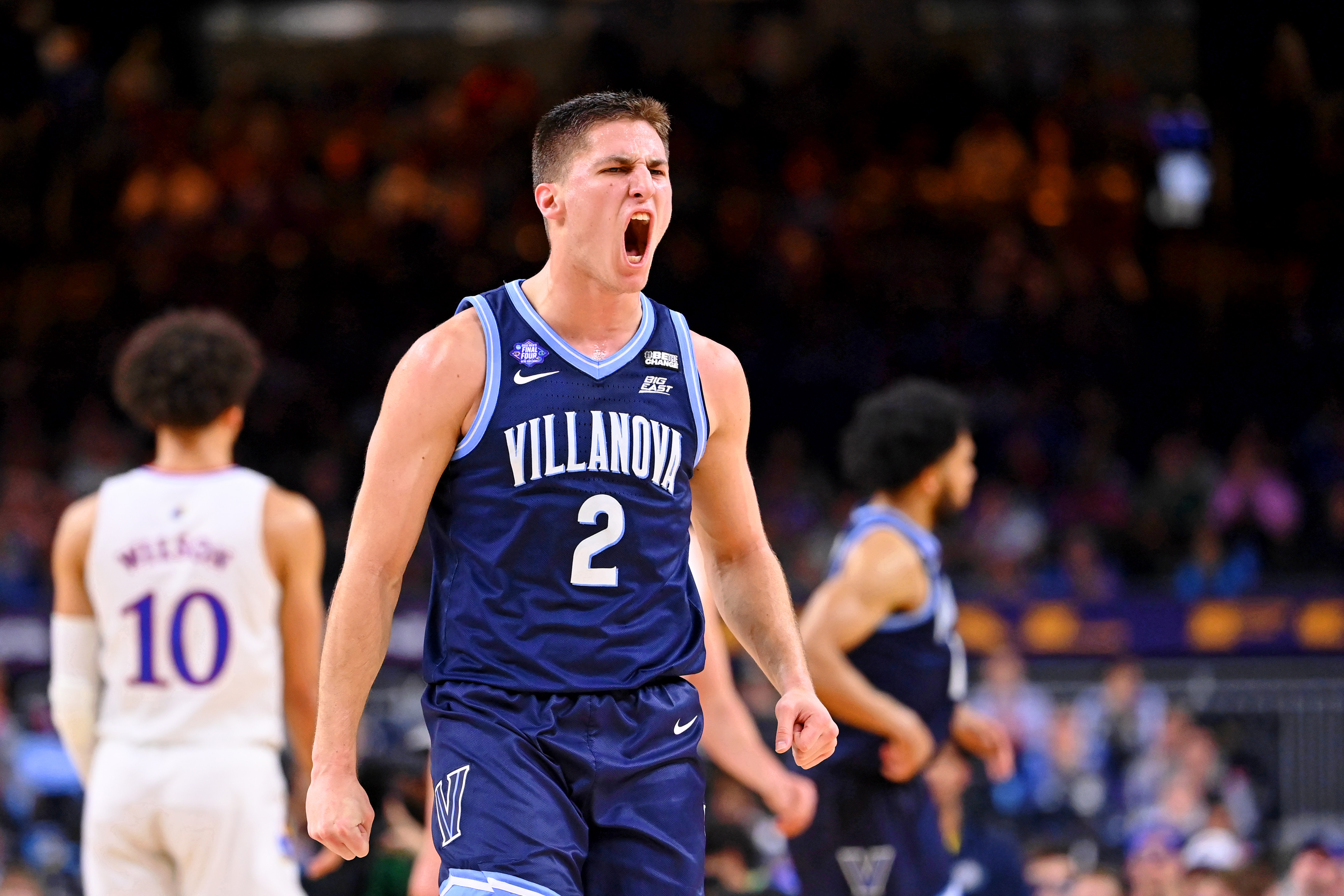 Villanova Wildcats guard Collin Gillespie (2) reacts after a play against the Kansas Jayhawks during the first half during the 2022 NCAA men's basketball tournament Final Four semifinals at Caesars Superdome.