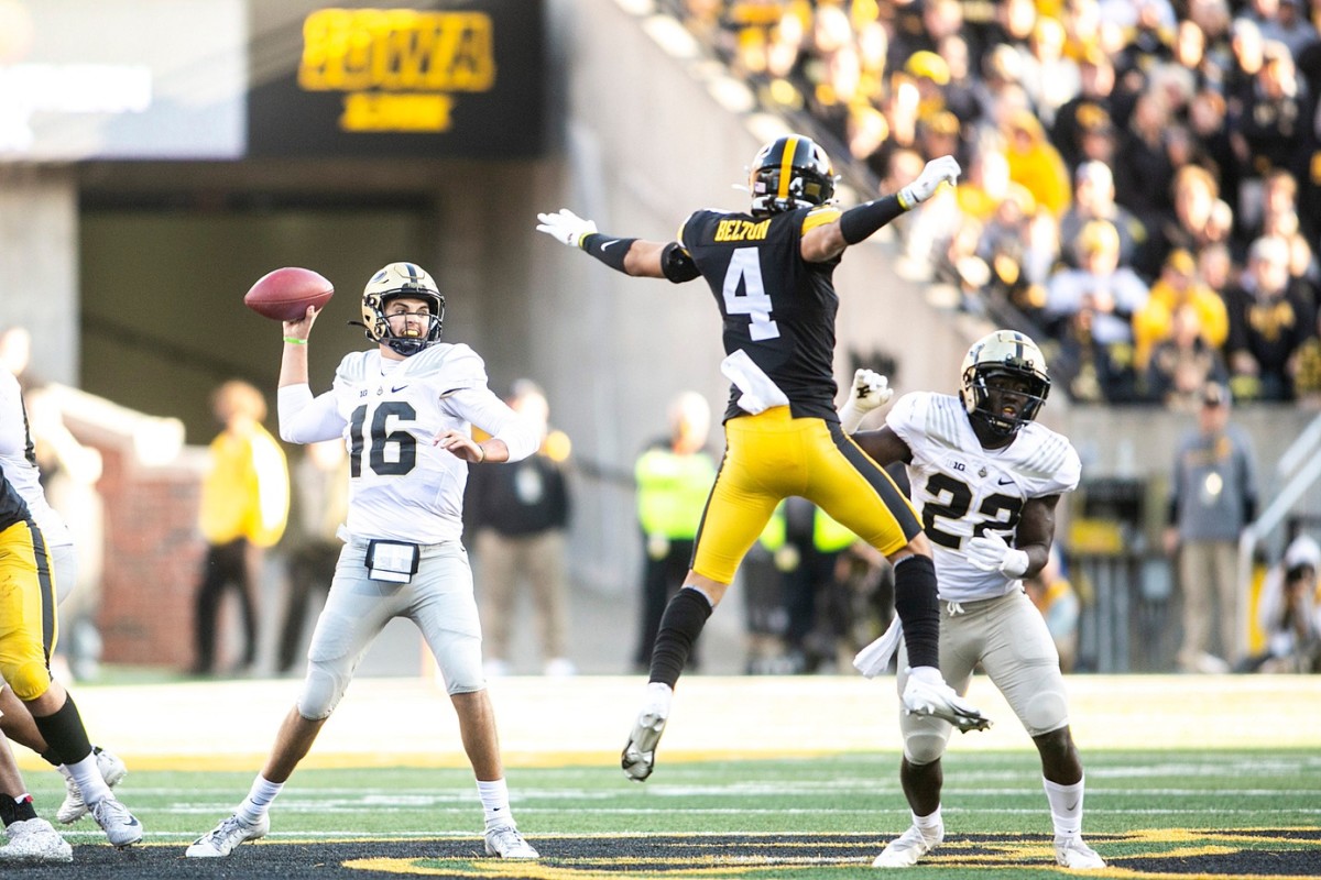 Purdue quarterback Aidan O'Connell (16) looks to pass as running back King Doerue (22) blocks against Iowa defensive back Dane Belton (4) during a NCAA Big Ten Conference football game, Saturday, Oct. 16, 2021, at Kinnick Stadium in Iowa City, Iowa.