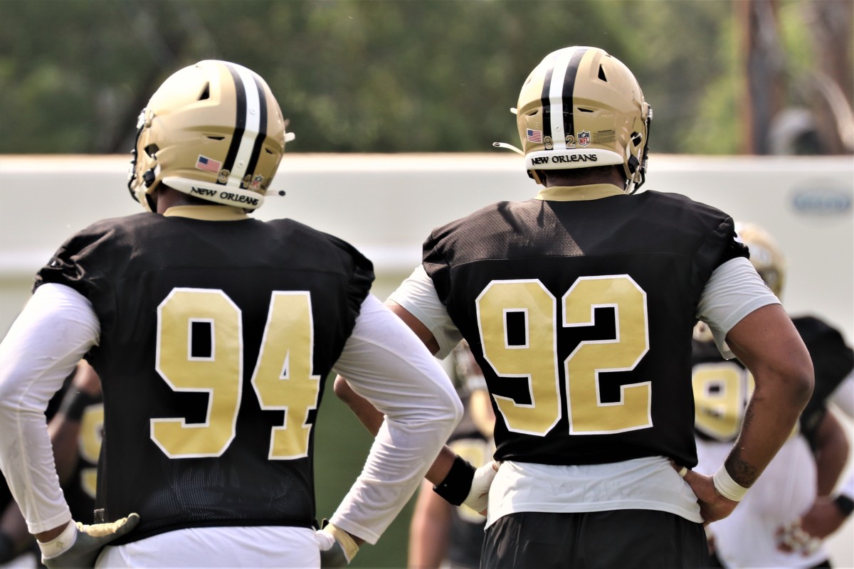 Cam Jordan and Marcus Davenport (2)